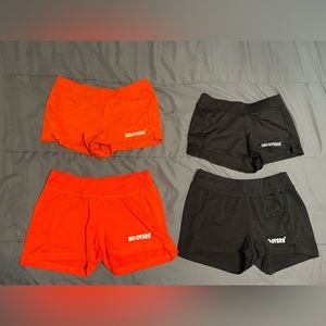 different size hooters shorts in orange and black